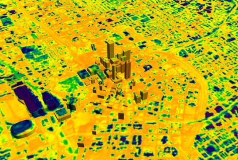 This image shows a zoomed-in thermal data image of downtown Atlanta night temperature. The image is mostly yellow. 3D buildings are in the middle of the image.